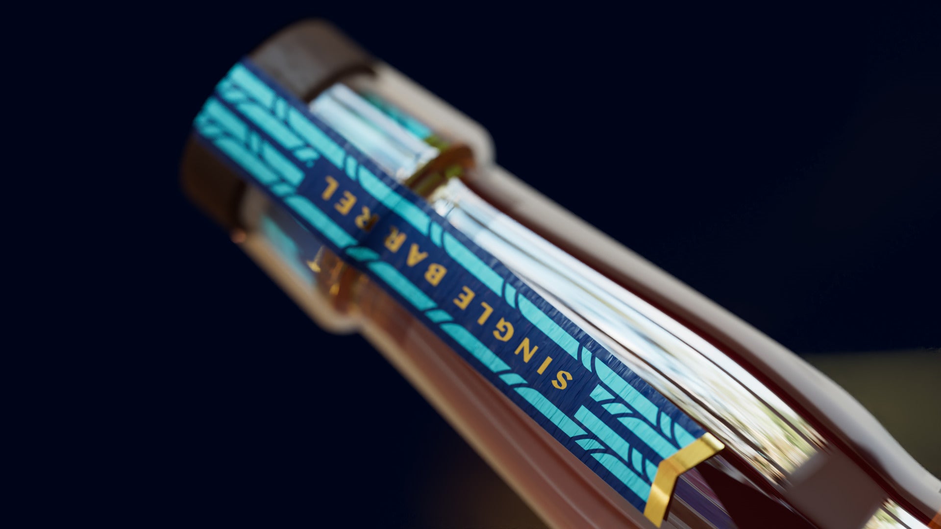 The bourbon neck from below, the teal Single Barrel strip running down the glass