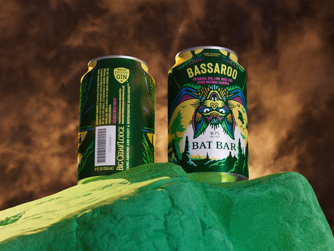 Early test: two Bassaroo cans on a mossy rock against an amber smoky sky.