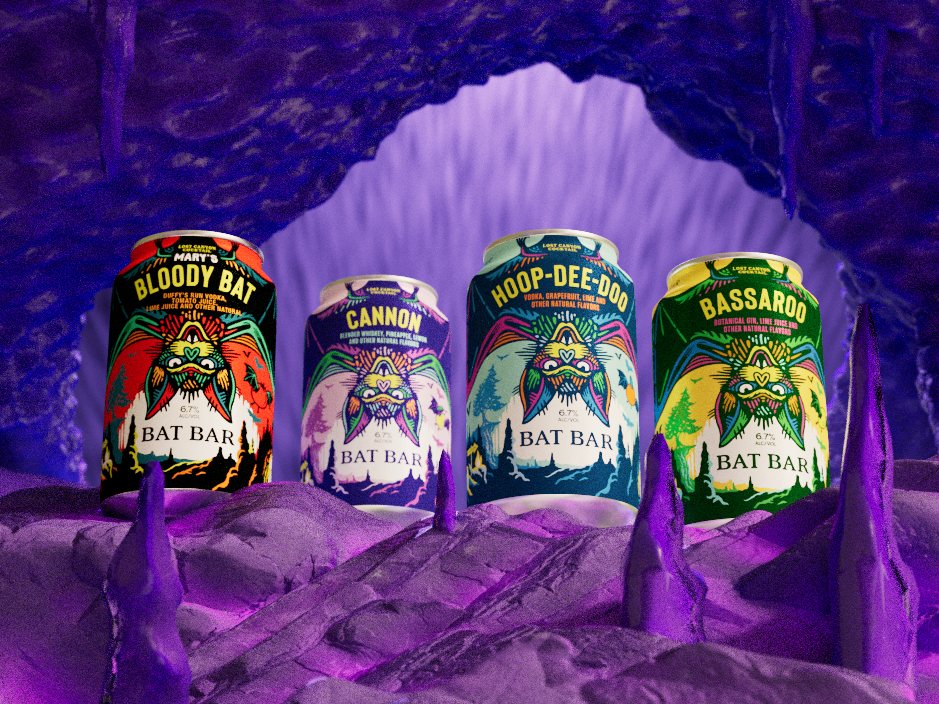 Test: four cans in front of a violet cave arch.