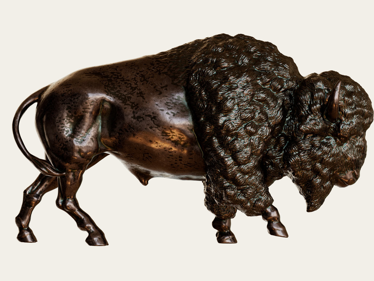 Complete bronze bison sculpt with textured fur and rim lighting