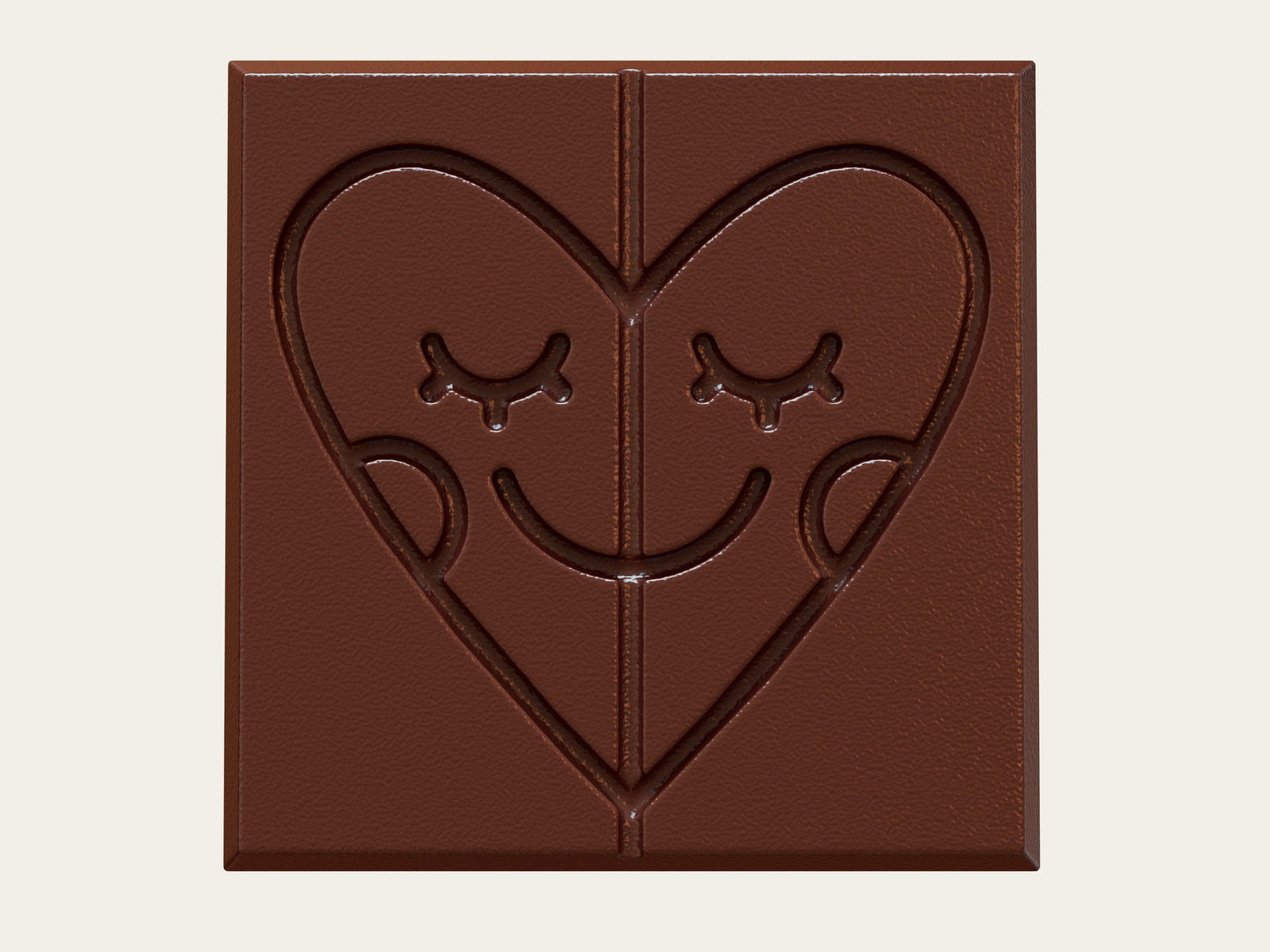 Dark chocolate bar from above with a pressed smiling heart