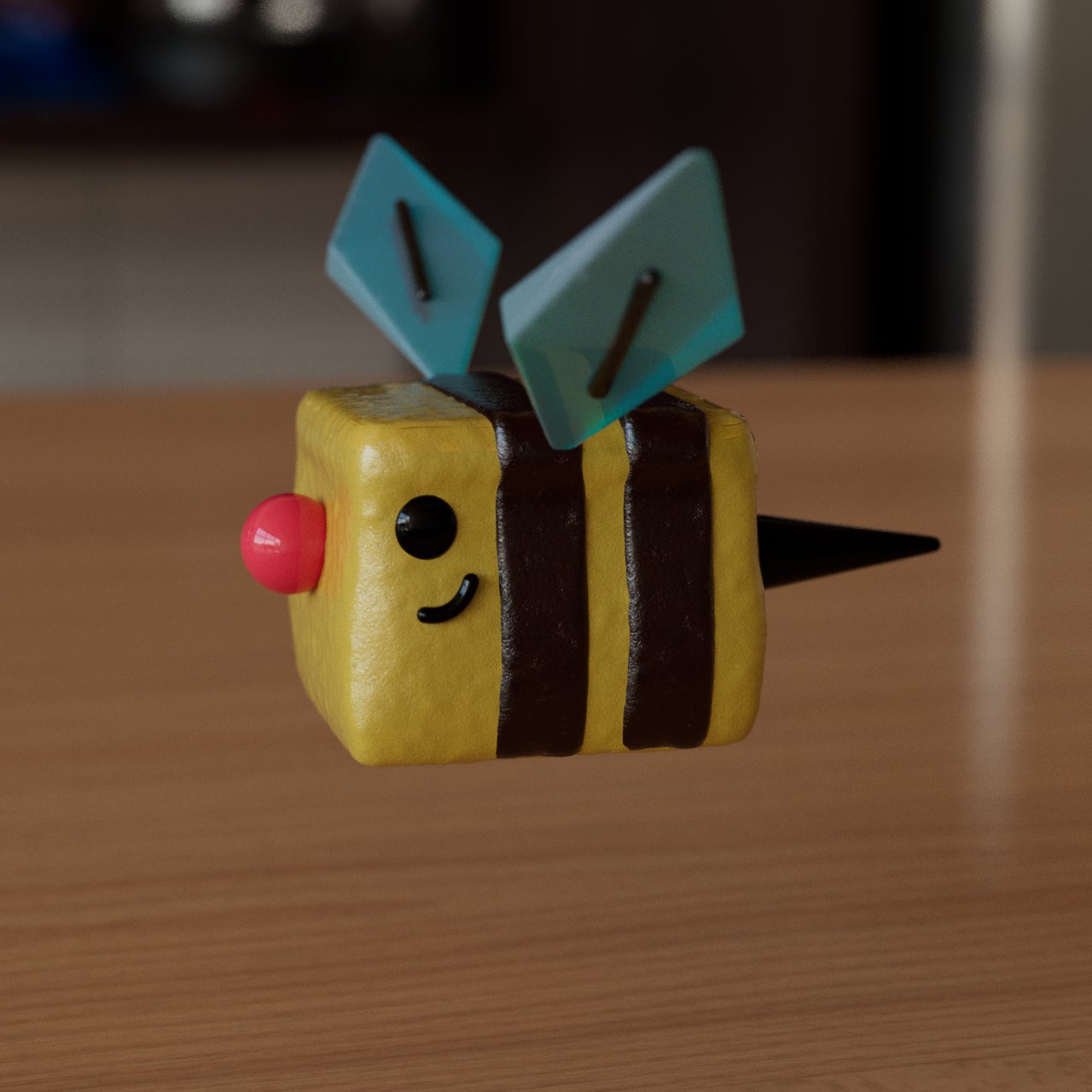 A marshmallow bee with yellow and brown stripes and two blue wings.