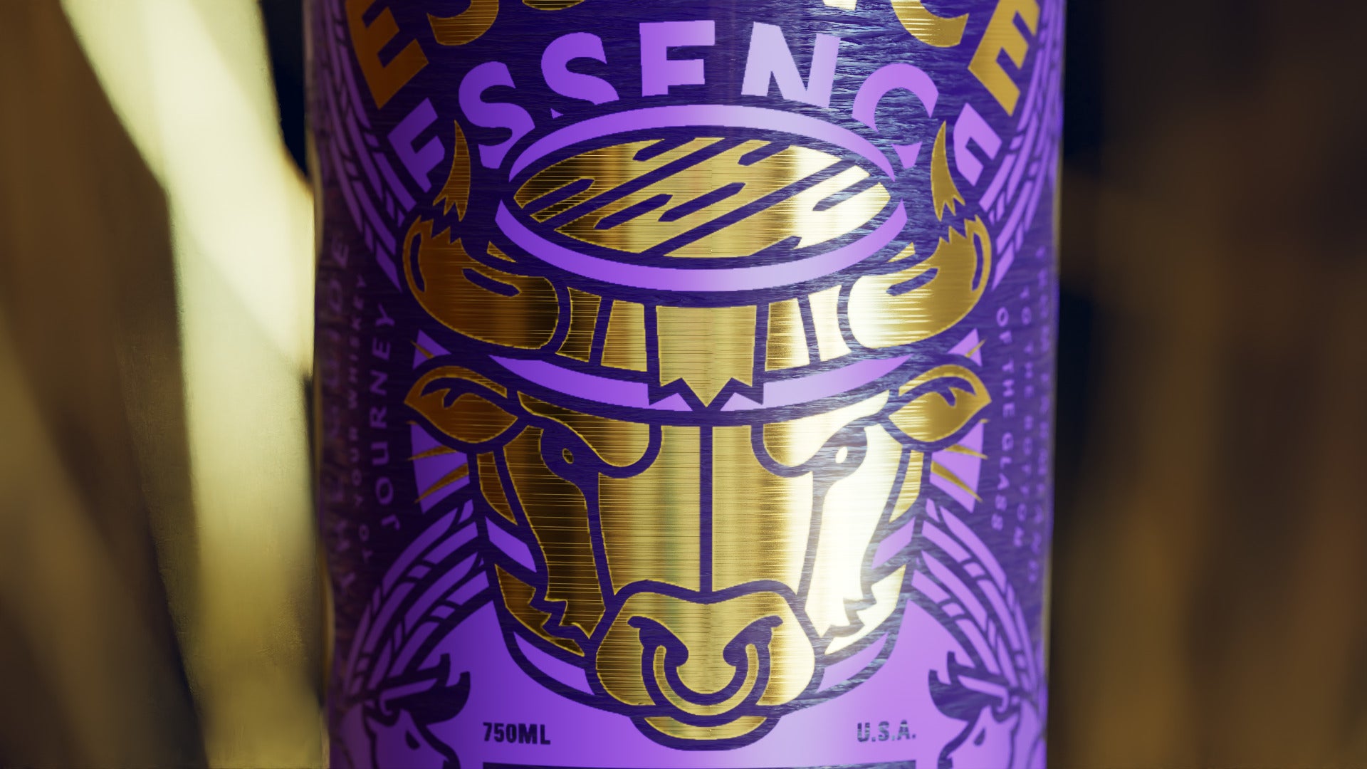 The rye label head-on: a gold foil bull with a ring through its nose, inside a barrel under ESSENCE