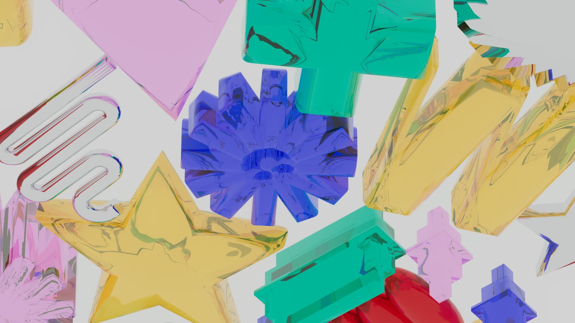 High angle over the glyph field: pink triangle, green block, blue starburst, gold star and a chrome squiggle piled on grey