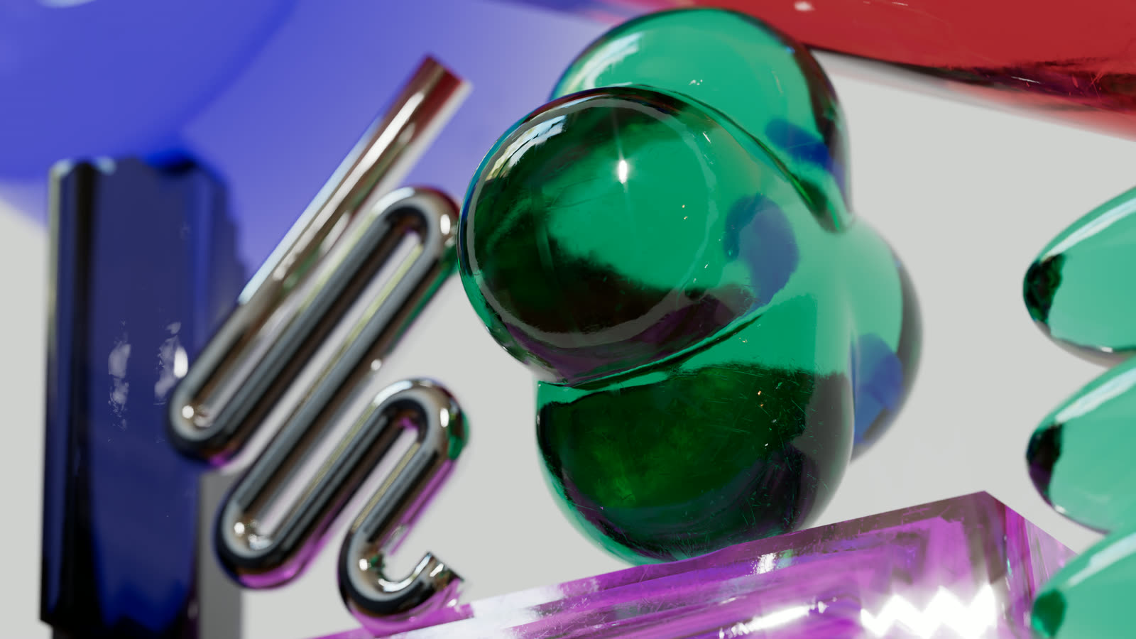 A green jelly clover beside a chrome squiggle, catching a star glint